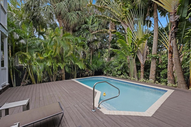 view of swimming pool with a wooden deck