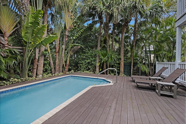 view of swimming pool with a deck