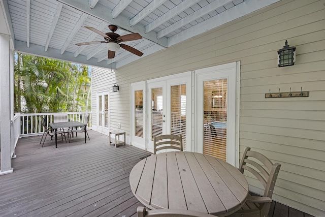 wooden terrace featuring french doors and ceiling fan