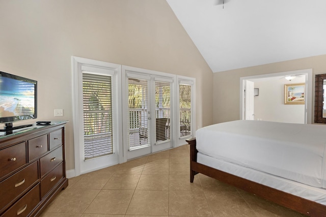 tiled bedroom featuring access to outside and high vaulted ceiling