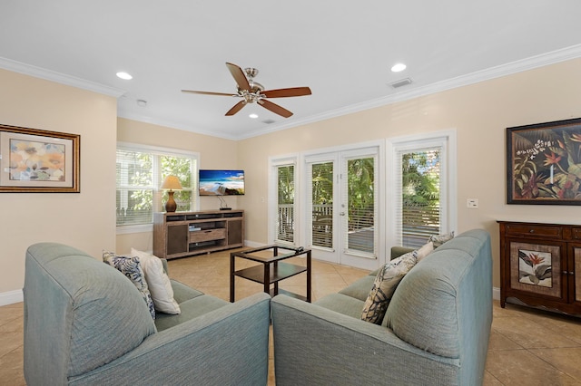 living room featuring light tile patterned floors, ornamental molding, french doors, and ceiling fan