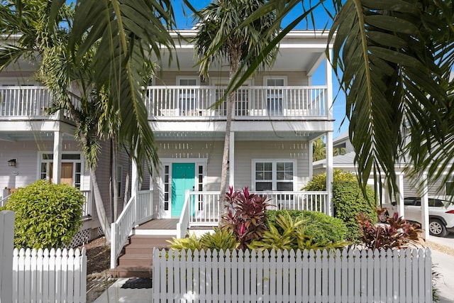 view of front of house with a balcony and a porch