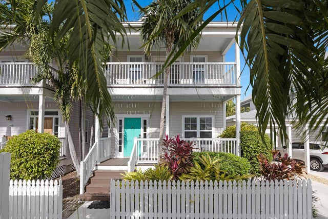 view of front of house with a balcony and a porch