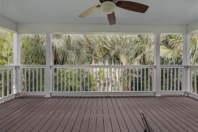 unfurnished sunroom featuring ceiling fan