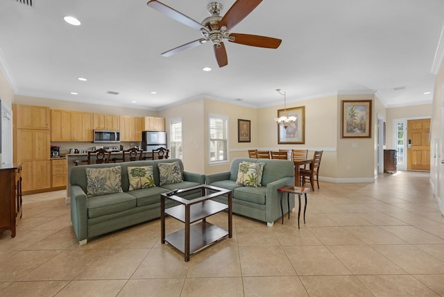 living room with light tile patterned floors, crown molding, and ceiling fan