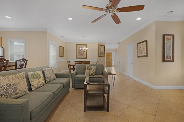 tiled living room featuring ceiling fan with notable chandelier and ornamental molding