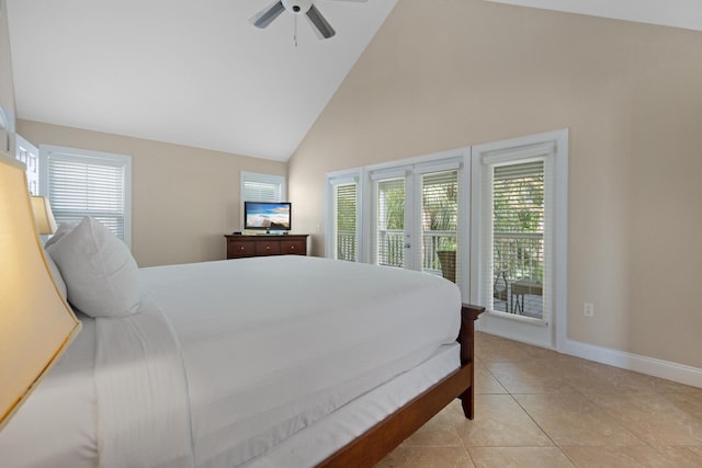 tiled bedroom with multiple windows, high vaulted ceiling, access to outside, and ceiling fan