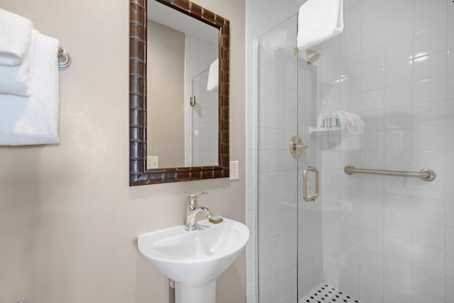 bathroom with sink and walk in shower