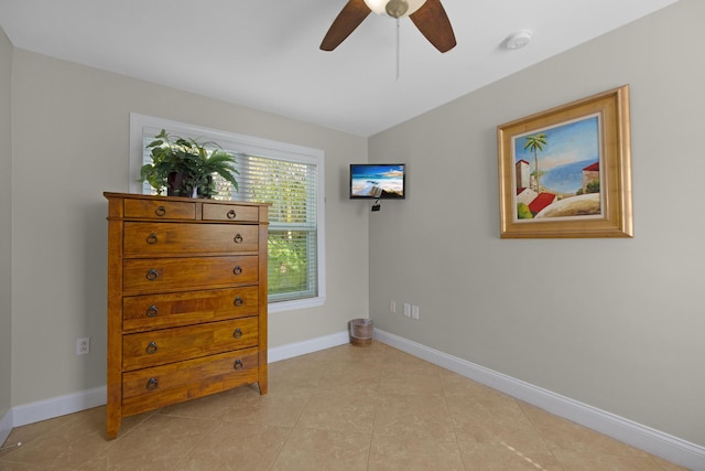 tiled bedroom with ceiling fan