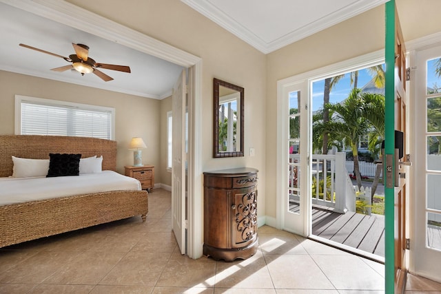 tiled bedroom with ceiling fan, ornamental molding, and access to exterior