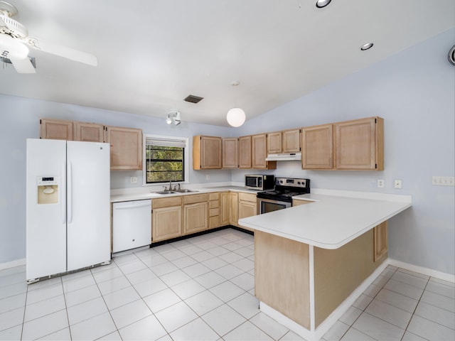 kitchen featuring under cabinet range hood, stainless steel appliances, light brown cabinetry, and light countertops