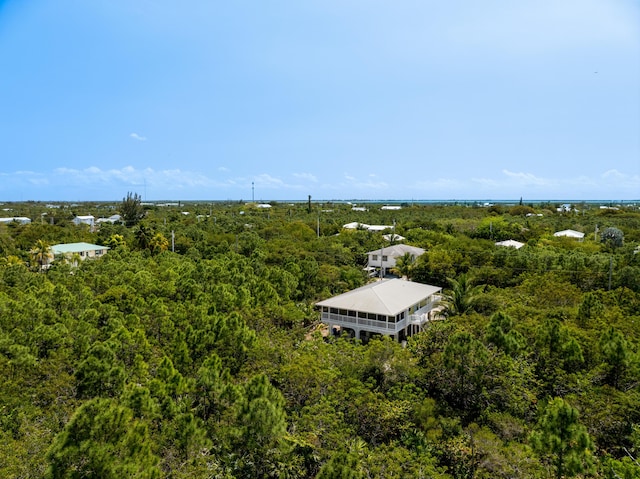 aerial view featuring a wooded view