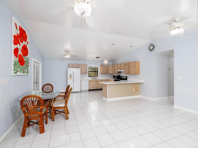 kitchen featuring a ceiling fan, white fridge with ice dispenser, light countertops, light tile patterned floors, and vaulted ceiling