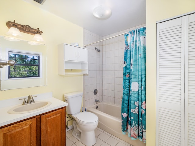 full bathroom with tile patterned floors, shower / tub combo with curtain, vanity, and toilet