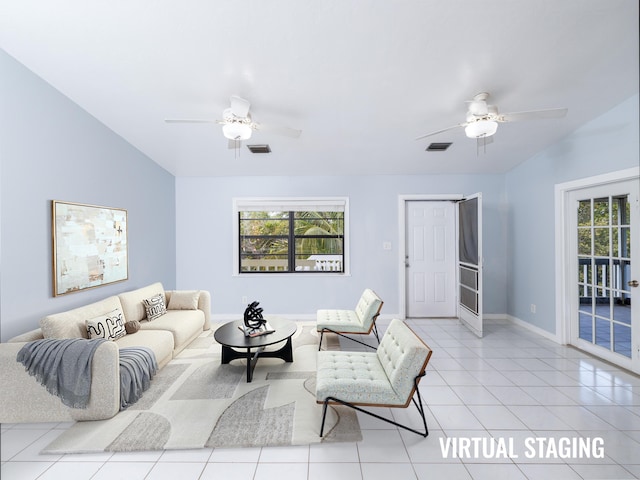 living room featuring visible vents, lofted ceiling, light tile patterned flooring, and a ceiling fan