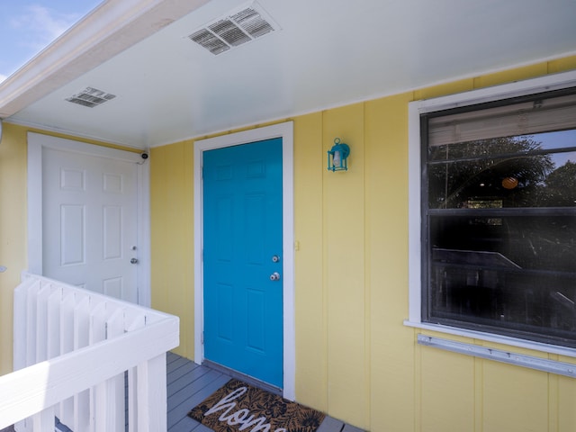 entrance to property featuring visible vents