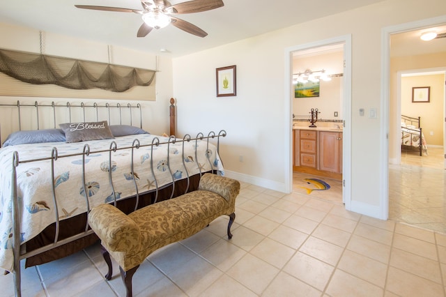 bedroom featuring light tile patterned floors, ceiling fan, and ensuite bathroom