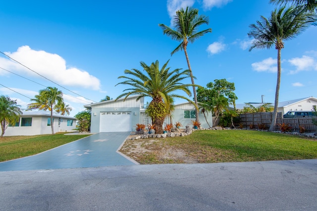 view of front of home featuring a garage and a front yard