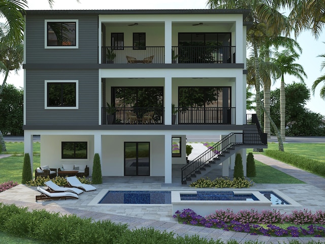 back of property featuring ceiling fan, a patio, and a balcony