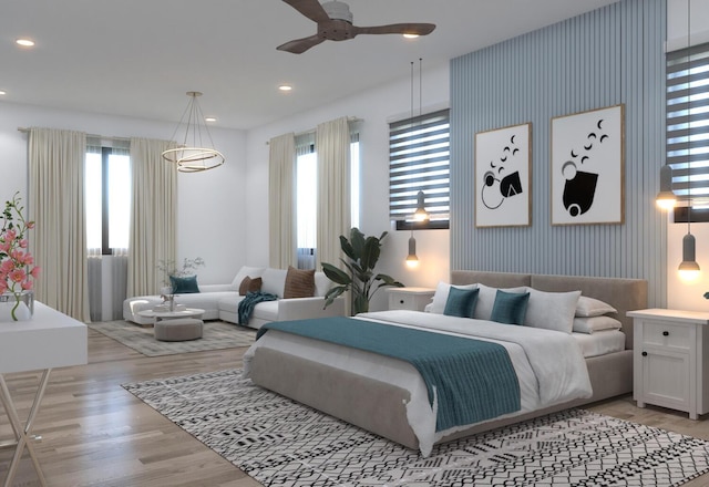 bedroom featuring ceiling fan and light hardwood / wood-style floors