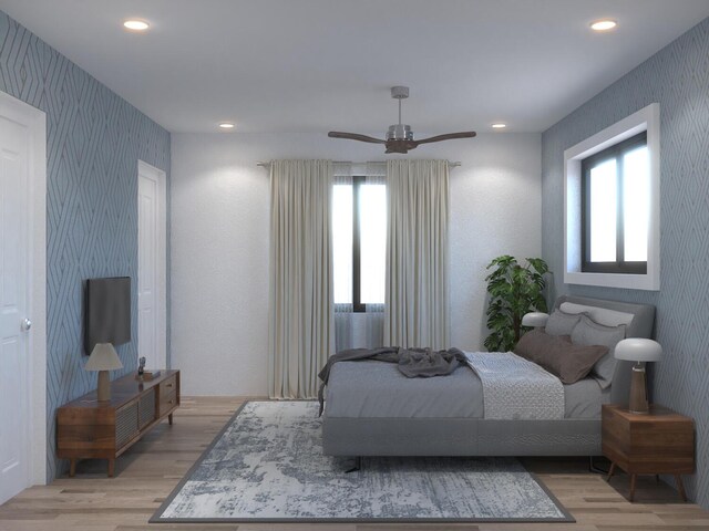 bedroom featuring light hardwood / wood-style flooring and ceiling fan