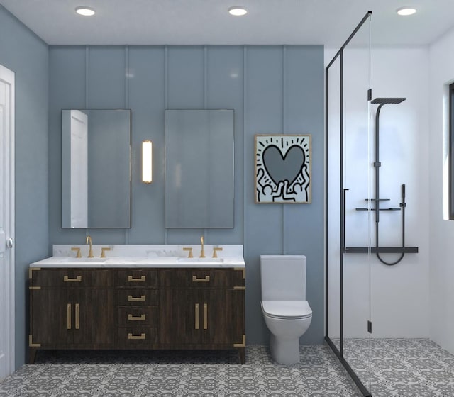 bathroom with tile patterned floors, vanity, toilet, and a shower with door