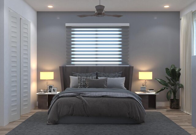 bedroom featuring ceiling fan and light wood-type flooring