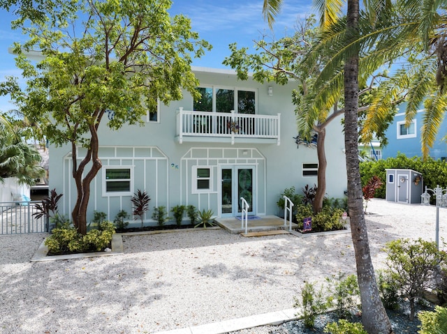 rear view of house featuring a balcony