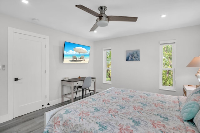 bedroom featuring wood-type flooring and ceiling fan