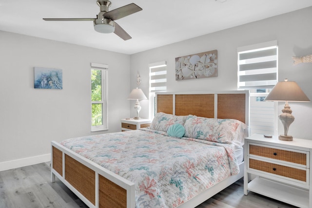 bedroom featuring hardwood / wood-style flooring and ceiling fan