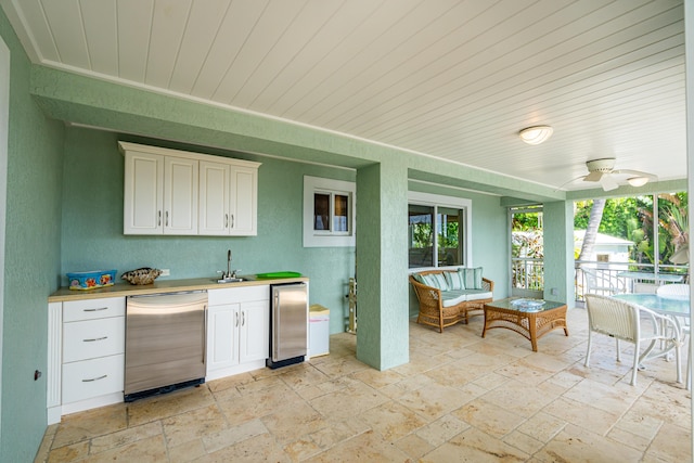 exterior space featuring an outdoor living space, area for grilling, sink, and ceiling fan