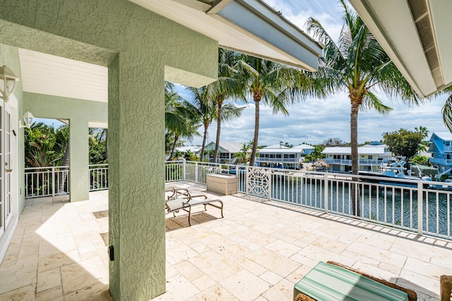 view of patio featuring a water view