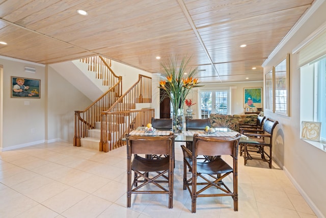 dining space with wood ceiling, crown molding, and light tile patterned flooring