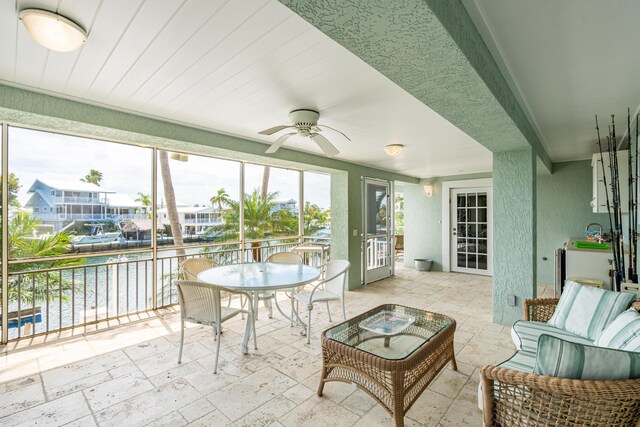 sunroom / solarium with ceiling fan