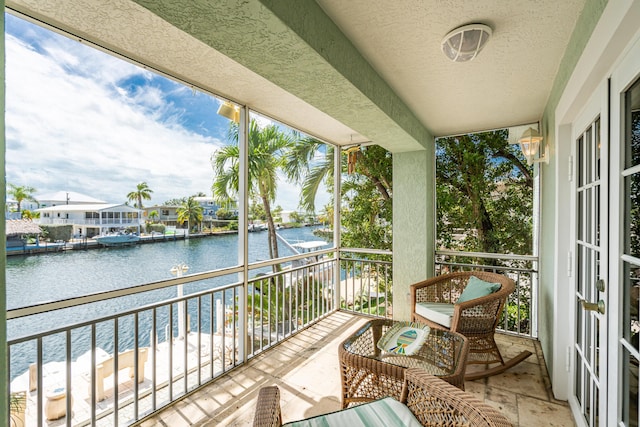 balcony featuring a water view