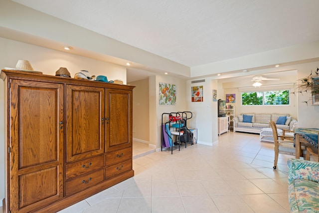 tiled living room with ceiling fan