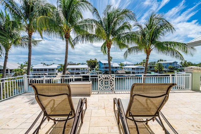 view of patio with a water view