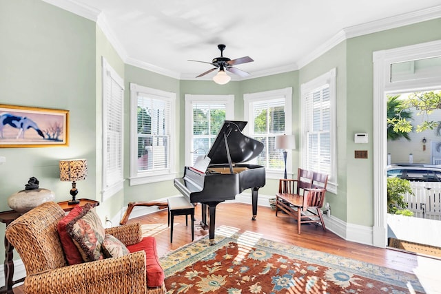 miscellaneous room featuring ceiling fan, ornamental molding, and hardwood / wood-style floors