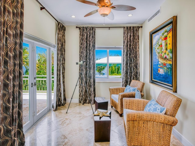 living area with french doors and ceiling fan