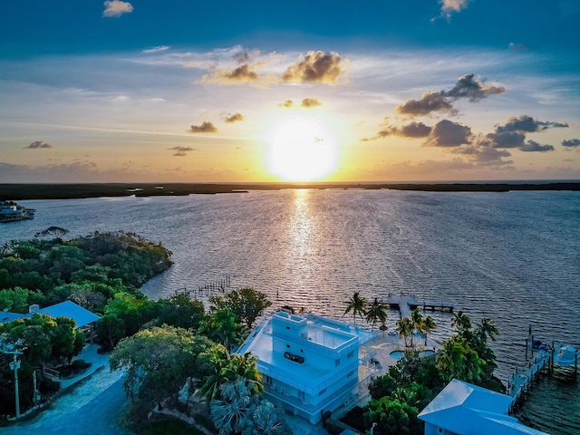 aerial view at dusk with a water view