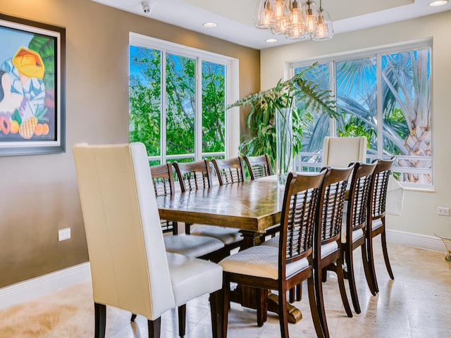 dining room with a notable chandelier