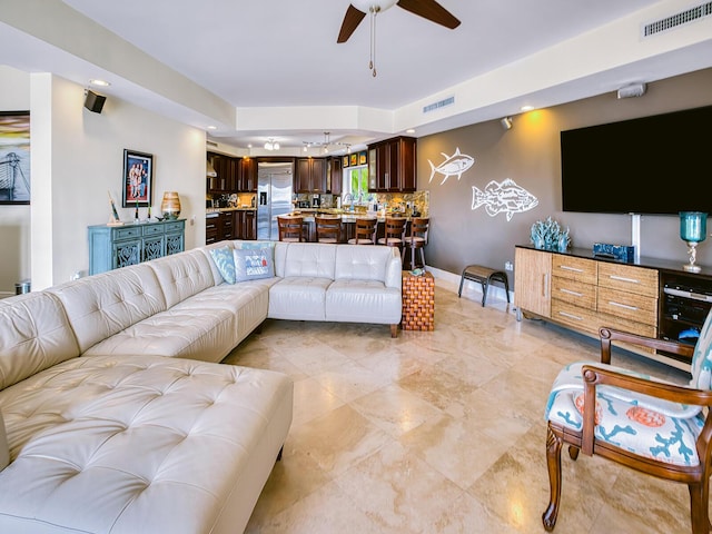 living room with ceiling fan