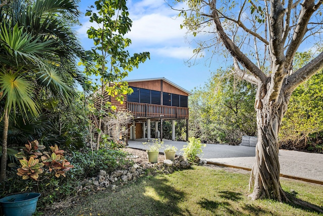 view of yard with a patio area and a sunroom