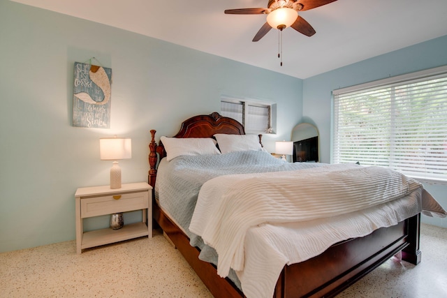 bedroom featuring a ceiling fan and speckled floor