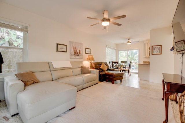 living area with a ceiling fan