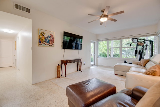 living room featuring visible vents and ceiling fan