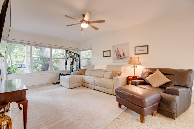 living area featuring ceiling fan