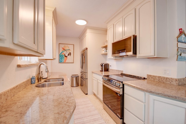 kitchen featuring appliances with stainless steel finishes and a sink