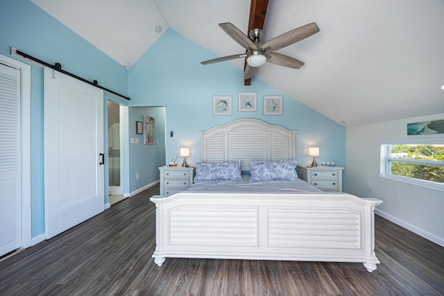 unfurnished bedroom featuring ceiling fan, a barn door, dark hardwood / wood-style flooring, and vaulted ceiling