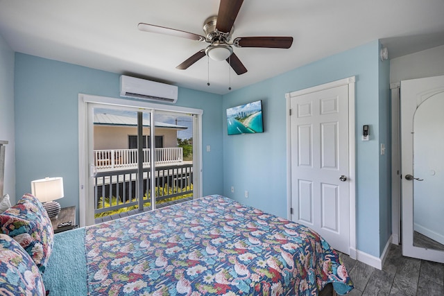 bedroom featuring dark wood-type flooring, ceiling fan, access to outside, and an AC wall unit